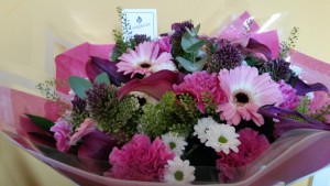 A pink and white hand-tied arrangement