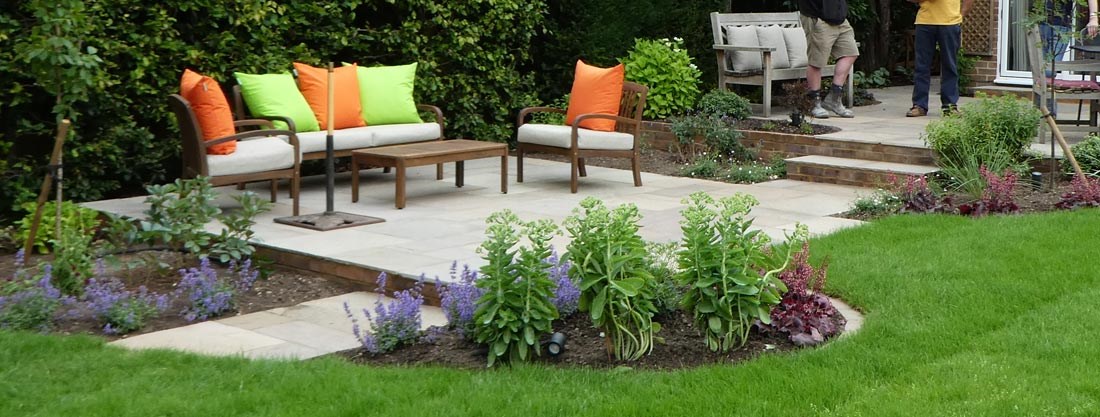 Split level garden with relaxed seating areas surrounded by fragrant planting