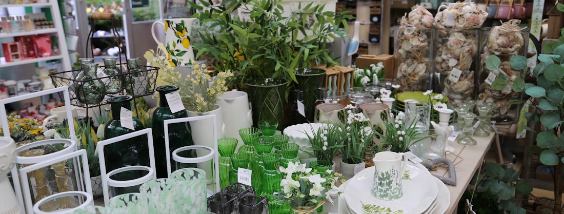 Longacres Chobham giftware table filled with glass items in a green colour scheme for gifts and home décor 