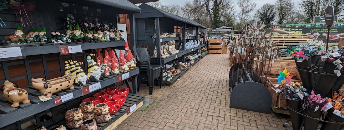 Longacres Shepperton garden decorations with colourful gnomes and plant supports