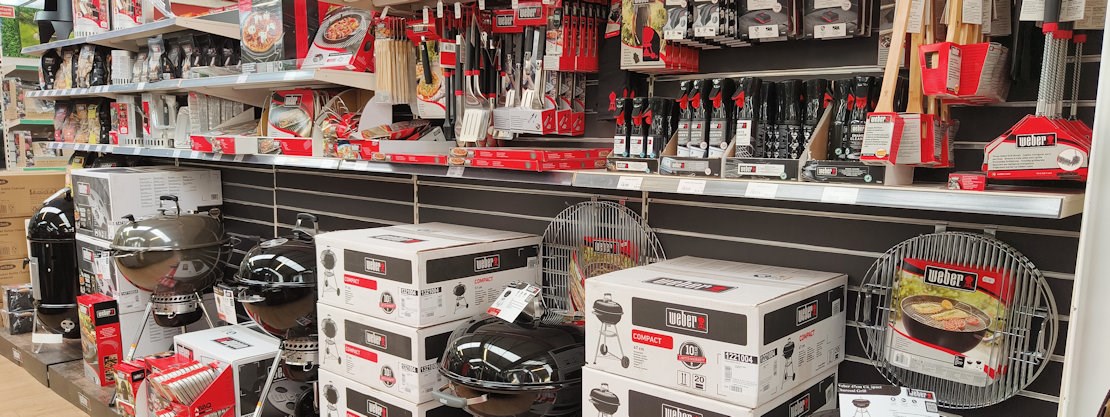 Longacres Shepperton barbecue display with charcoal barbecues and grilling accessories