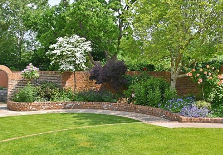 Timeless Walled Garden with a mixed shrub and perennial cottage border