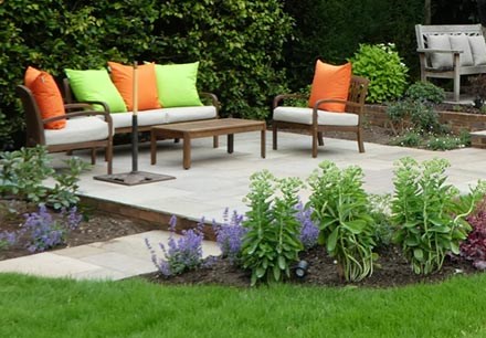 Split level garden with relaxed seating areas surrounded by fragrant planting