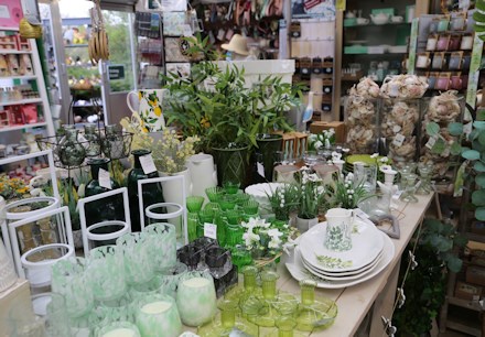 Longacres Chobham giftware table filled with glass items in a green colour scheme for gifts and home décor 