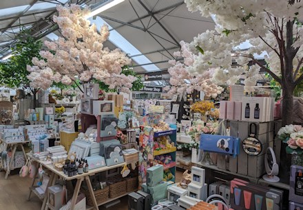 Longacres Shepperton giftware department with artificial blossom tree displays and gift ideas