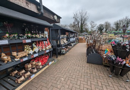 Longacres Shepperton garden decorations with colourful gnomes and plant supports