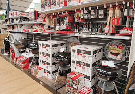 Longacres Shepperton barbecue display with charcoal barbecues and grilling accessories