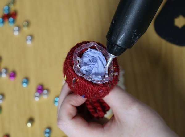 covering the base of the hat with hot glue