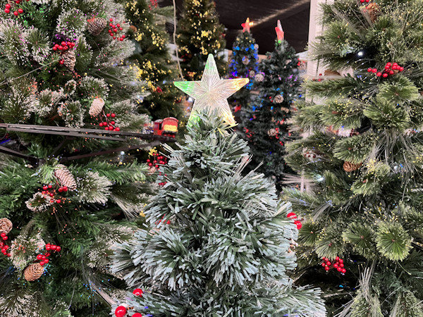 Image of three fibre optic artificial Christmas trees